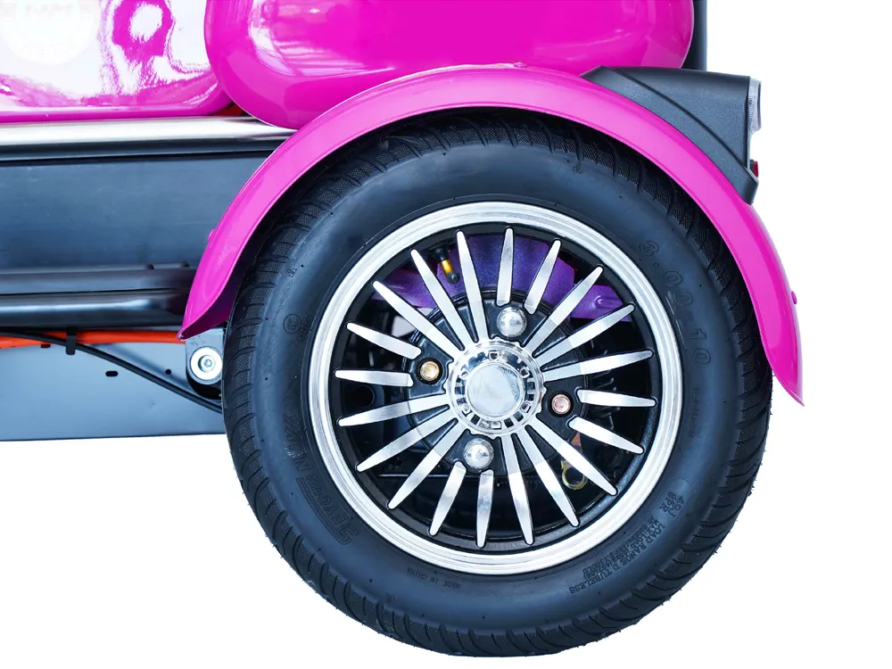 Close-up of the rear wheel of an electric tricycle, highlighting the durable tire, reinforced frame, and braking system for safe and stable urban commuting