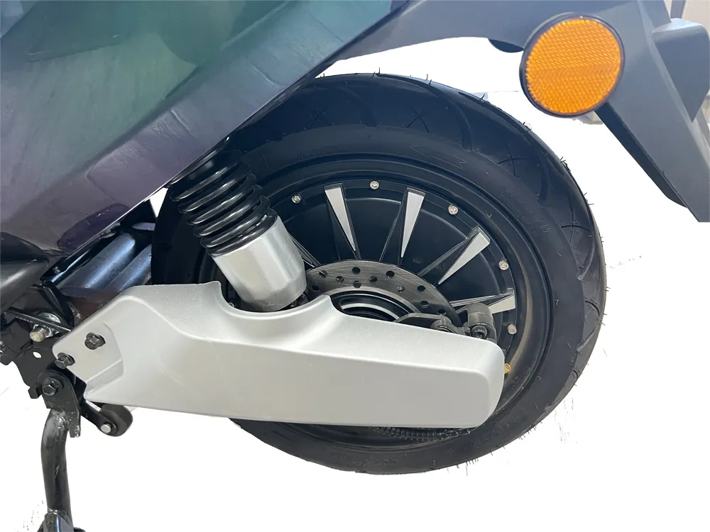 Close-up of electric scooter rear wheel with integrated hub motor and rear swing arm structure