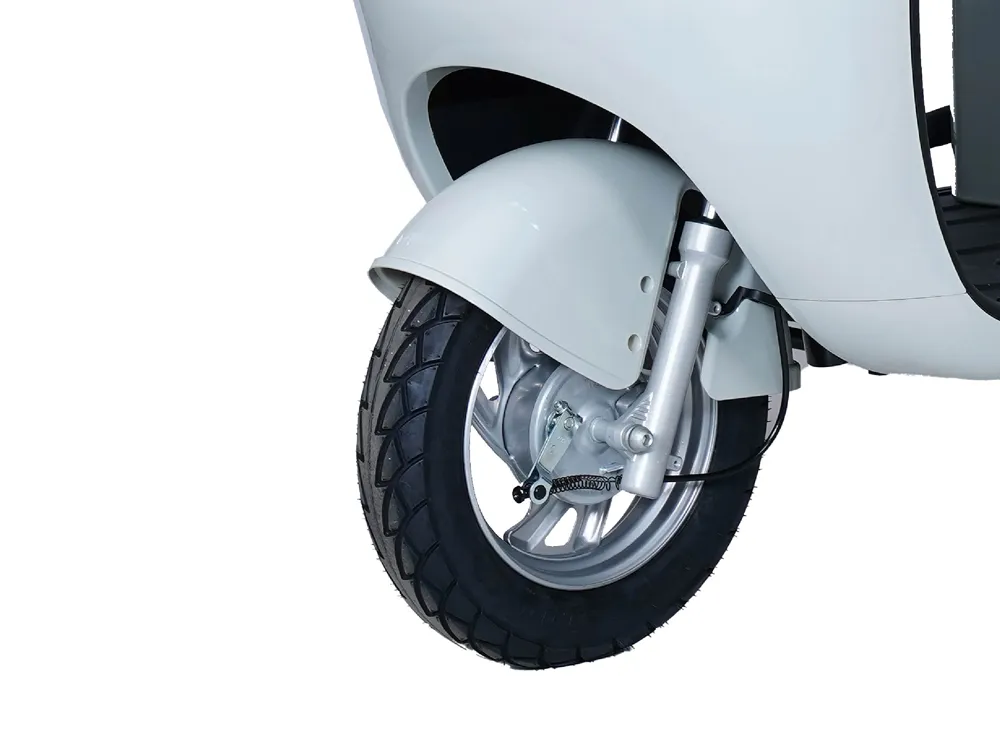 Close-up of the front wheel of a light blue electric convertible tricycle, highlighting the durable tire, suspension system, and braking components for enhanced stability and safety