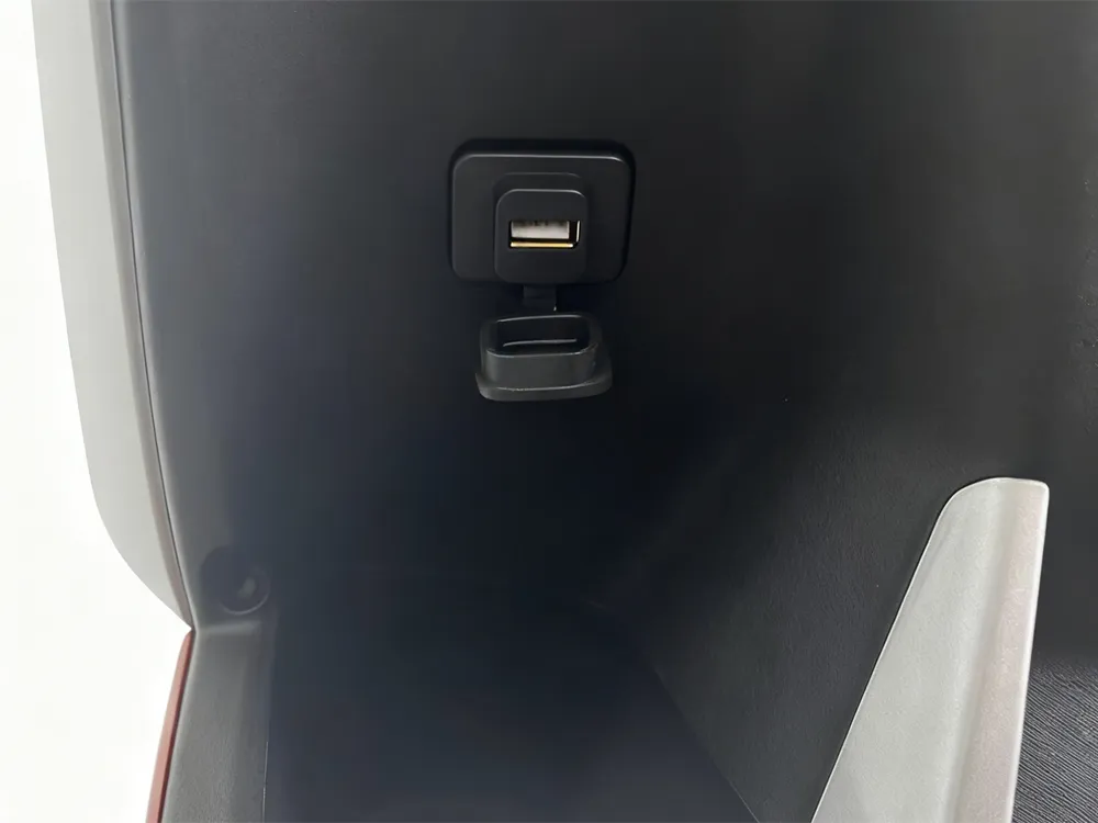 Close-up of electric scooter USB charging port, highlighting its design and functionality