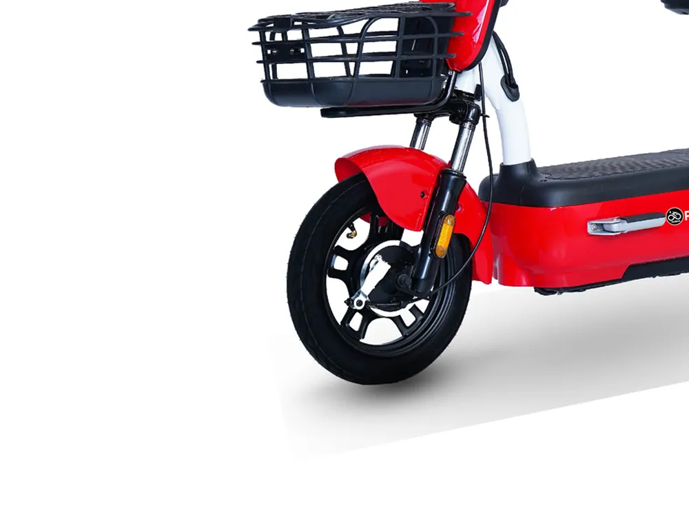 Close-up view of the front wheel of a red electric scooter, highlighting the tire tread, disc brake, and hub for enhanced stability and safety in city commuting