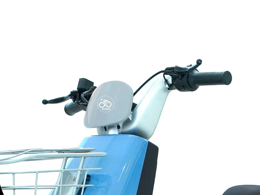 Close-up of blue electric scooter handlebars and front basket, highlighting ergonomic grips, control switches, and storage for urban commuting