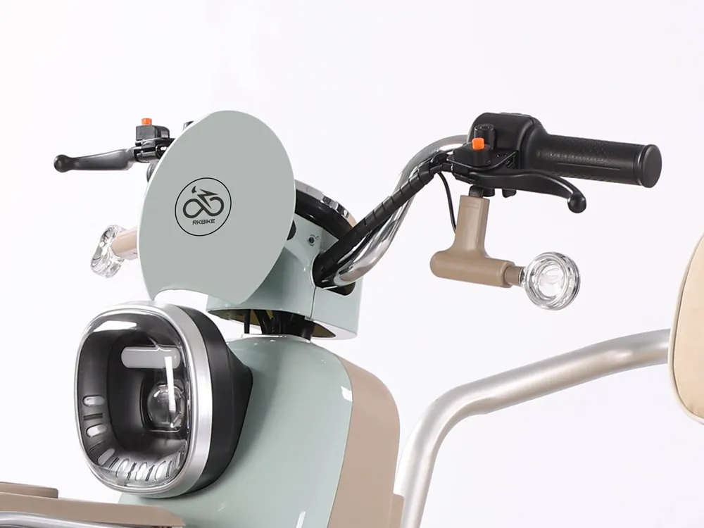 Close-up of the headlight and handlebar of an electric tricycle, highlighting ergonomic grips, high-quality controls, and bright headlight for safe urban commuting